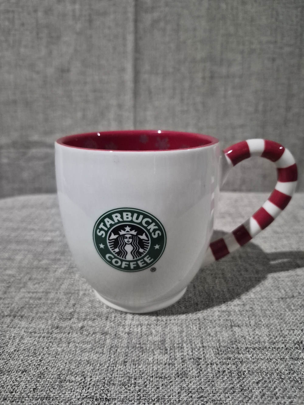 Starbucks White Ceramic Mug with Red Interior and Candy Cane Handle